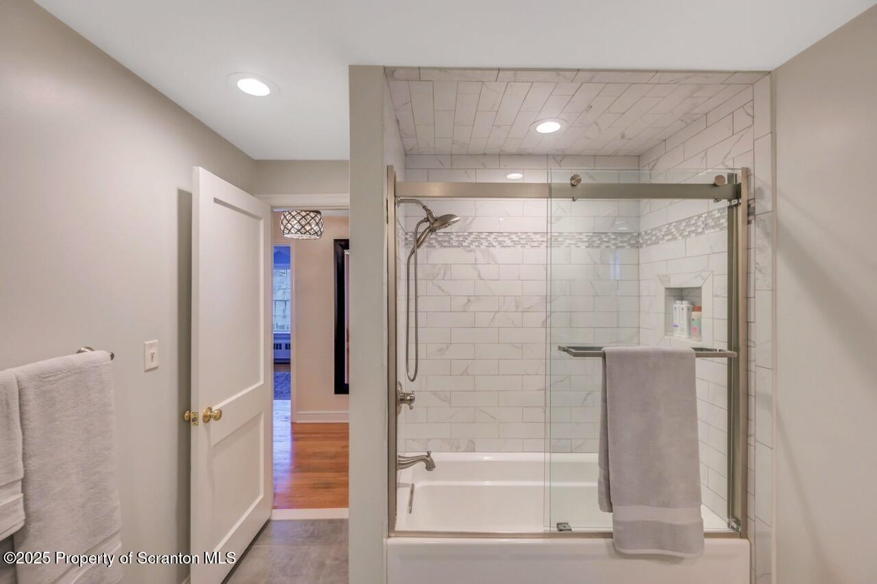 235 North Abington Road Clarks Green, PA 18411 - Photo 62 of 79 a bathroom with a shower and a glass door