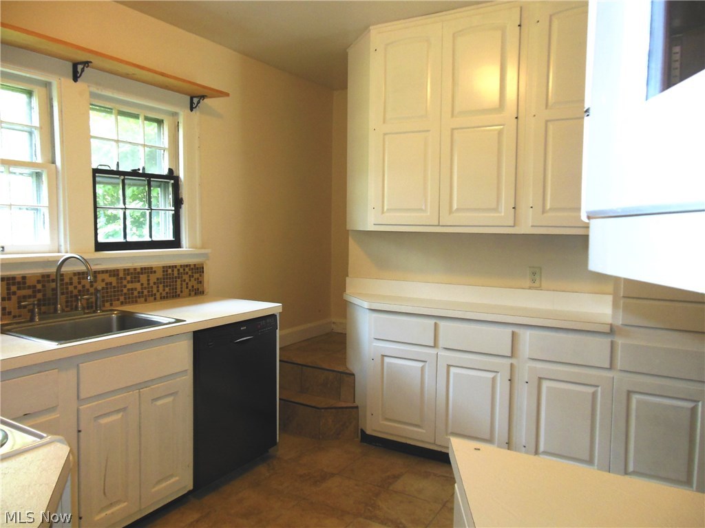 2129 Hubbard Road Madison, OH 44057 - Photo 11 of 27 Step Saver kitchen still has tons of storage with cabinets that go clear up to the ceiling.