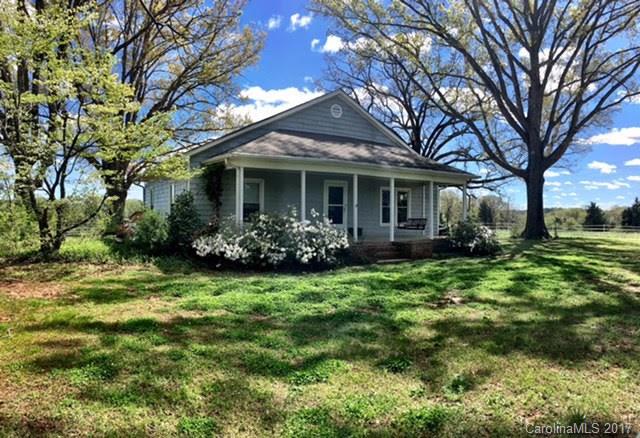 7503 Potter Road Waxhaw, NC 28173 - Photo 1 of 18 a front view of a house with a garden