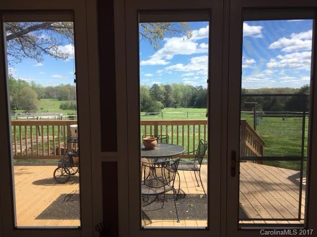 7503 Potter Road Waxhaw, NC 28173 - Photo 2 of 18 a view of a glass door from the balcony
