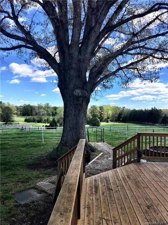 7503 Potter Road Waxhaw, NC 28173 - Photo 11 of 18 a view of a wooden deck next to a yard
