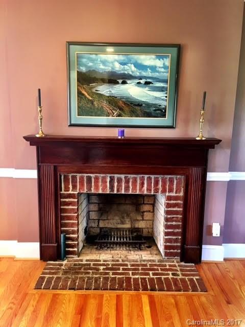 7503 Potter Road Waxhaw, NC 28173 - Photo 6 of 18 a living room with a fireplace and a flat screen tv