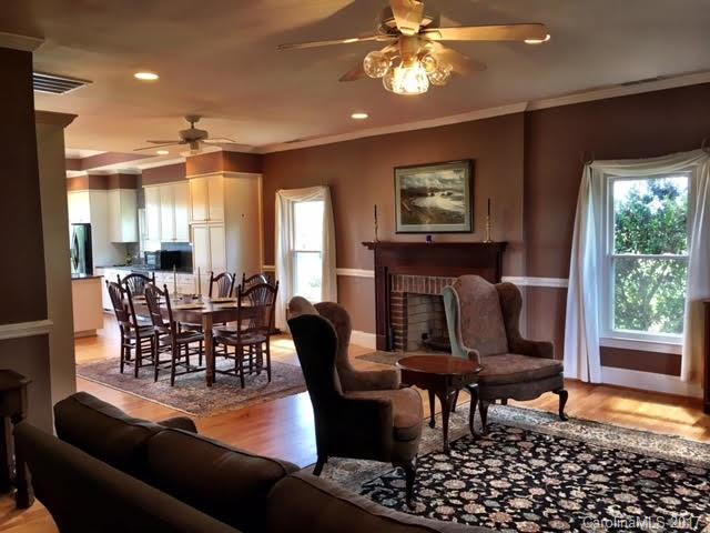 7503 Potter Road Waxhaw, NC 28173 - Photo 7 of 18 a living room with furniture a window and a flat screen tv