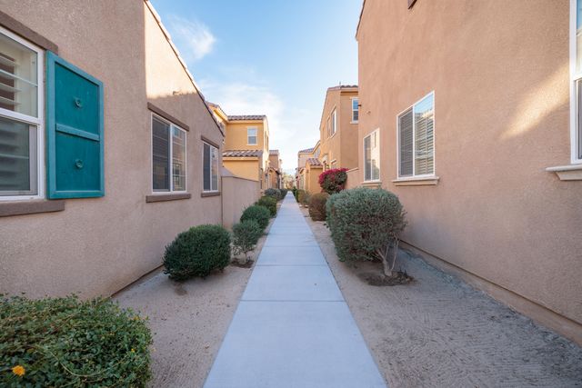 a view of a pathway with a house on both side