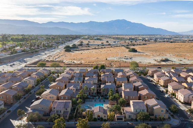 an aerial view of residential building and lake