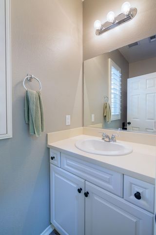 a bathroom with a sink and mirror