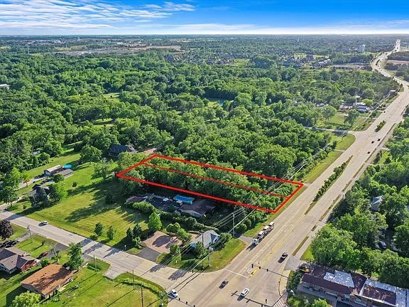 a view of a garden with an outdoor seating