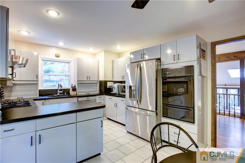 24 Donald Road East Brunswick, NJ 08816 - Photo 12 of 20 a kitchen with granite countertop a refrigerator and a sink
