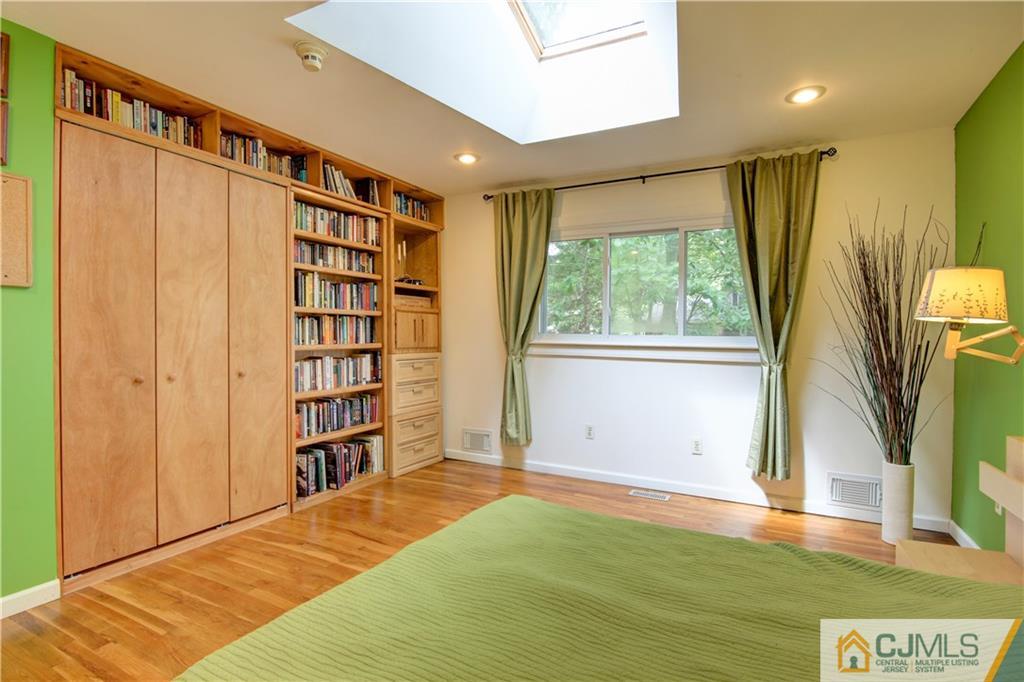 24 Donald Road East Brunswick, NJ 08816 - Photo 14 of 20 a view of bedroom with a large window and book shelf