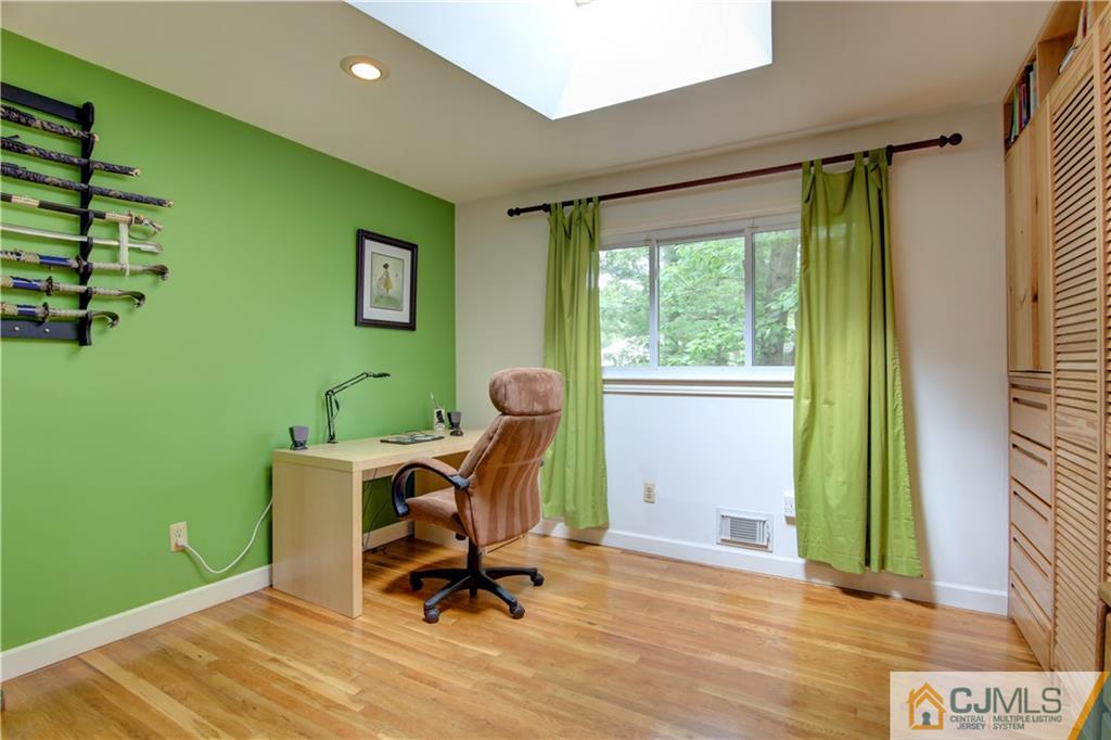 24 Donald Road East Brunswick, NJ 08816 - Photo 15 of 20 a view of a workspace with furniture and a window