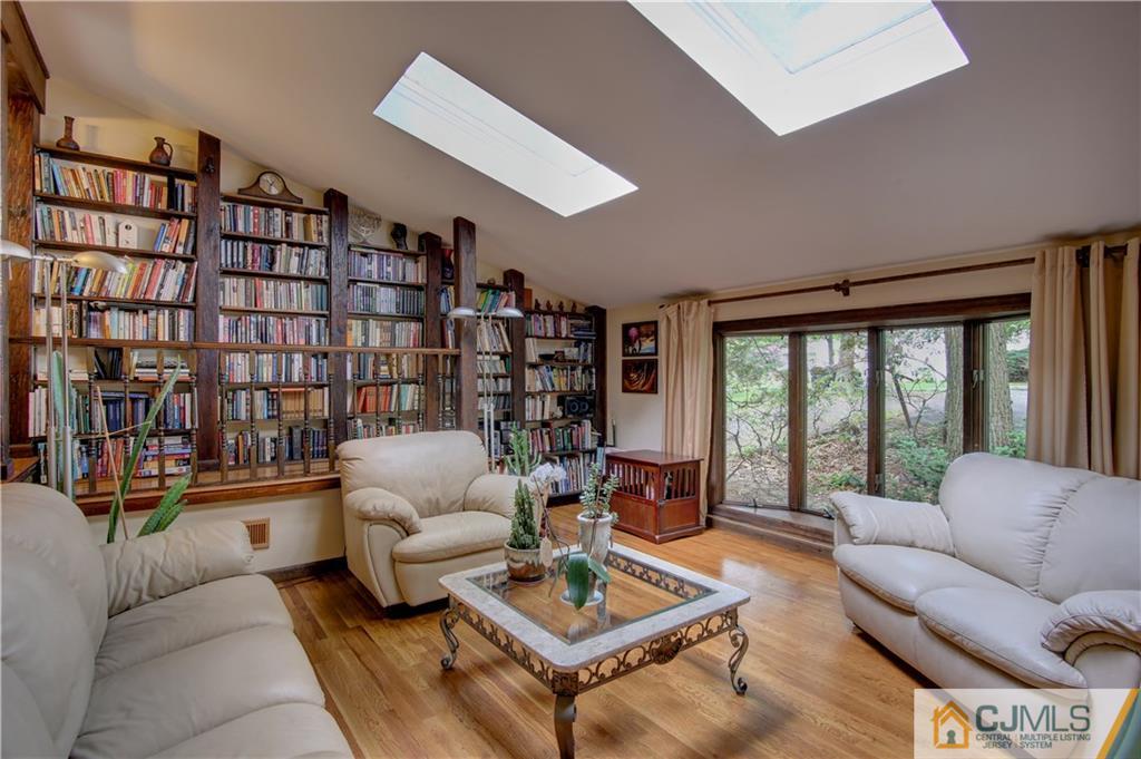 24 Donald Road East Brunswick, NJ 08816 - Photo 3 of 20 a living room with furniture a rug and a large window