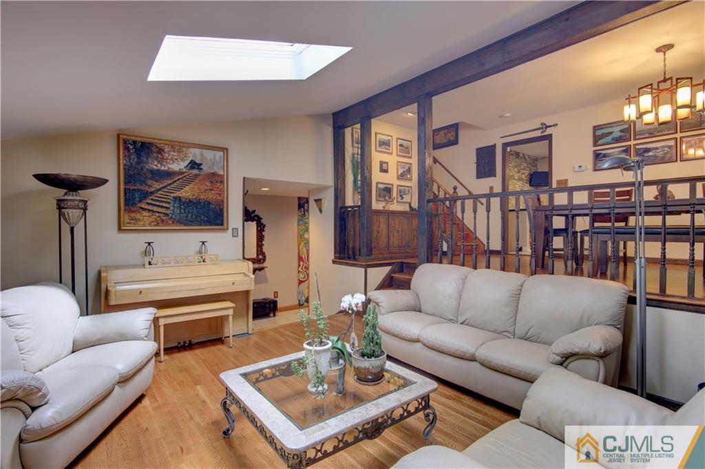 24 Donald Road East Brunswick, NJ 08816 - Photo 4 of 20 a living room with furniture a rug and a window