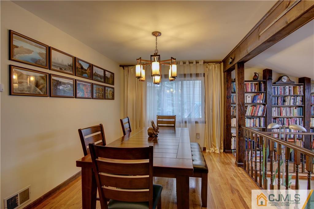24 Donald Road East Brunswick, NJ 08816 - Photo 6 of 20 a view of a dining room with furniture and wooden floor
