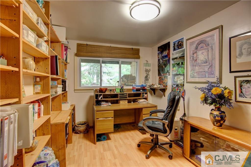 24 Donald Road East Brunswick, NJ 08816 - Photo 9 of 20 a view of a workspace with furniture and a window