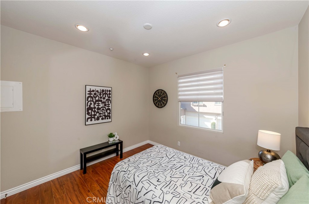 372 Quail Irvine, CA 92603 - Photo 11 of 22 a bedroom with a bed and a window