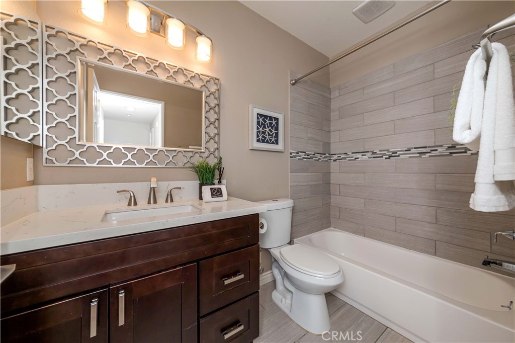 372 Quail Irvine, CA 92603 - Photo 13 of 22 a bathroom with a sink a toilet and shower