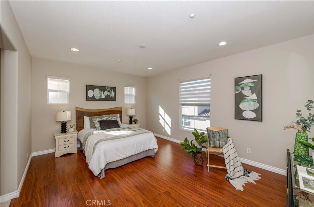 372 Quail Irvine, CA 92603 - Photo 14 of 22 a bedroom with a bed and a wooden floor