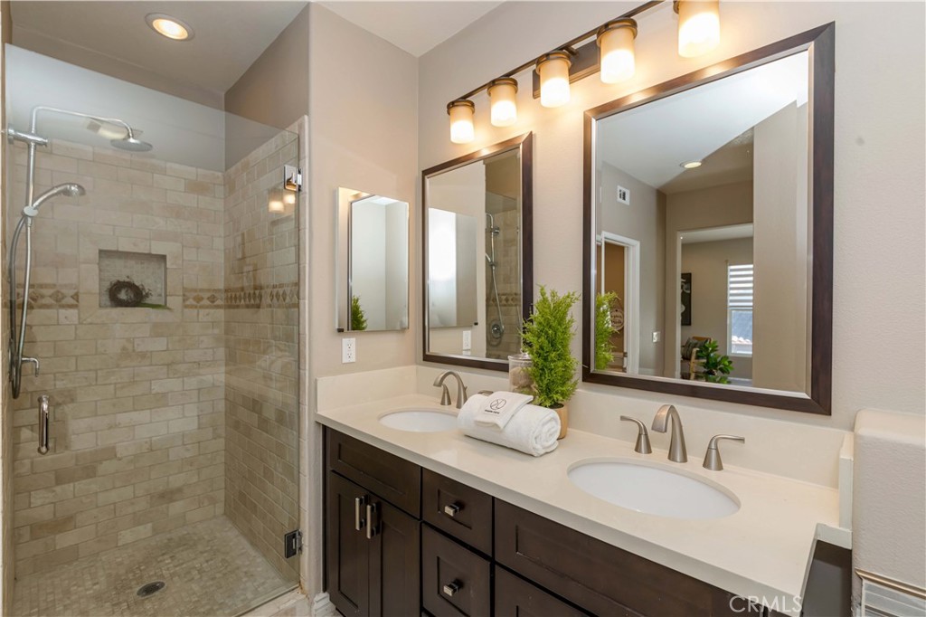 372 Quail Irvine, CA 92603 - Photo 18 of 22 a bathroom with a granite countertop sink mirror and double