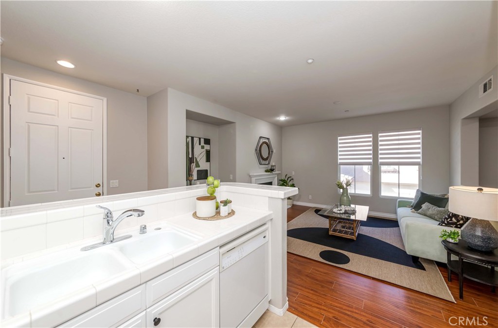 372 Quail Irvine, CA 92603 - Photo 7 of 22 a spacious bathroom with a granite countertop sink and a mirror