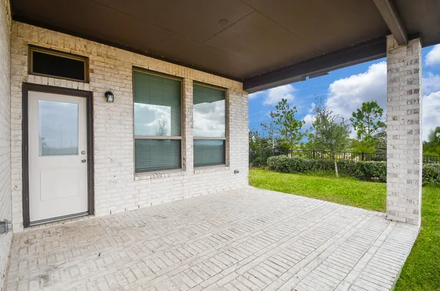 a view of a big room with a yard and plants