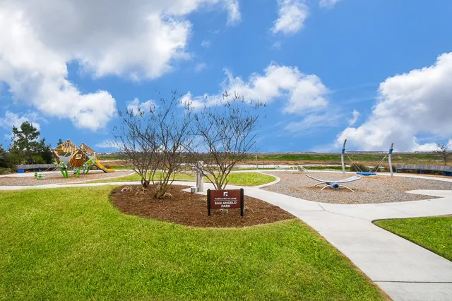 a view of a swimming pool with a yard