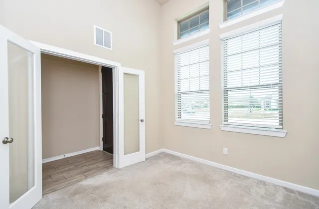 a view of an empty room with a window