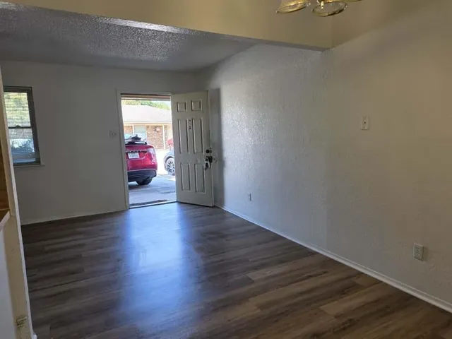 a view of livingroom with hardwood floor and hallway