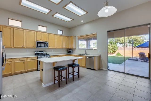 a kitchen with sink cabinets and window