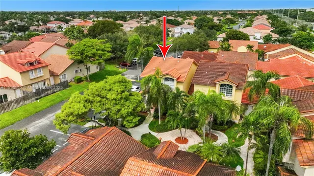 an aerial view of residential houses with outdoor space