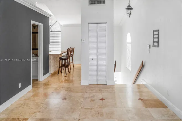 a view of a hallway with seating area