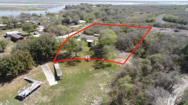 an aerial view of a houses with a road