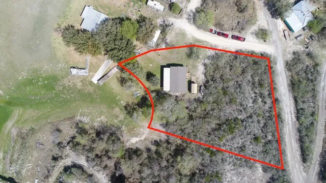 a picture of a tree in front of a house