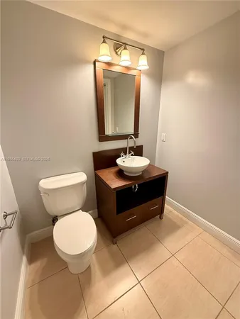 an empty room with a window and ceiling fan