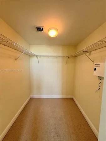 a bathroom with a sink a toilet a mirror and shower