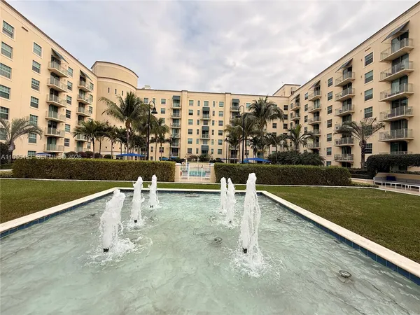 a view of a patio with a table and chairs