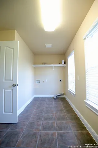 a view of an empty room and a window