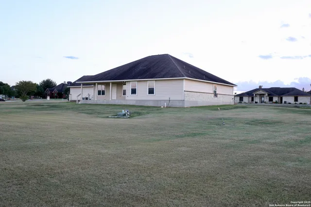 a view of a house with a big yard