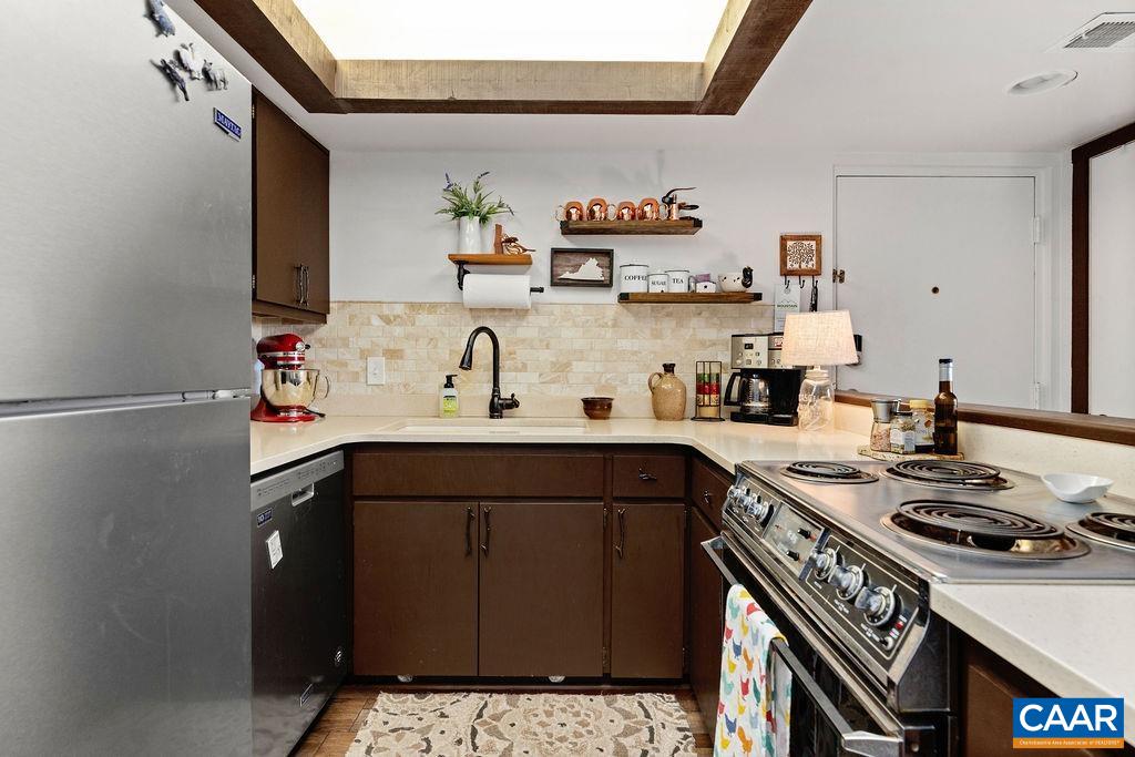 1403 Highlands Roseland, VA 22967 - Photo 19 of 29 a kitchen with a sink stove and cabinets