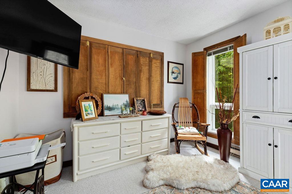 1403 Highlands Roseland, VA 22967 - Photo 22 of 29 a room with a chair and large windows