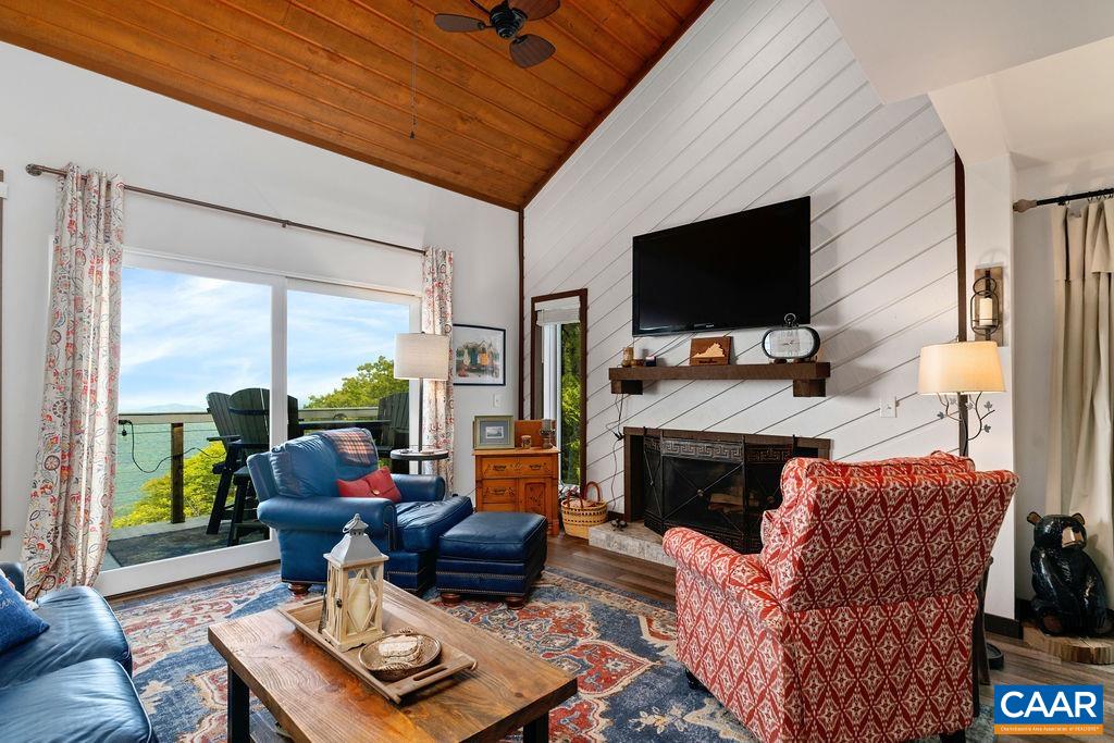 1403 Highlands Roseland, VA 22967 - Photo 7 of 29 a living room with furniture a flat screen tv and a fireplace