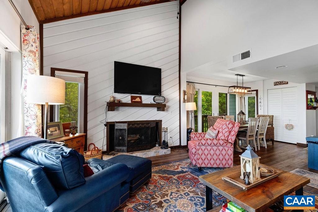 1403 Highlands Roseland, VA 22967 - Photo 9 of 29 a living room with furniture a flat screen tv and a fireplace
