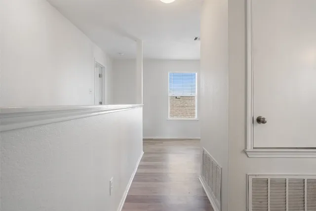 a view of a hallway with closet