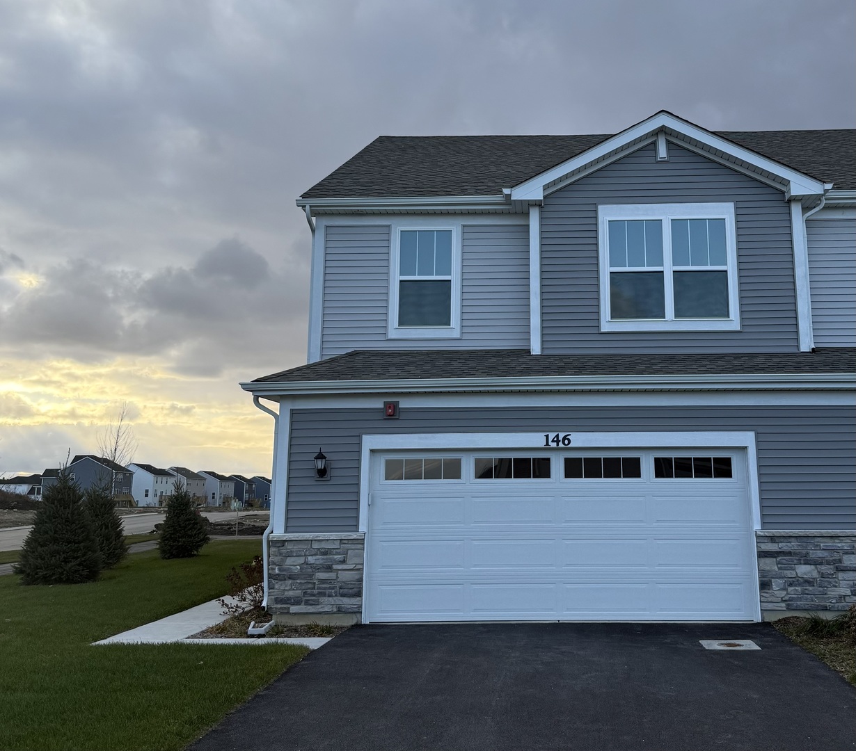 a front view of a house with a yard