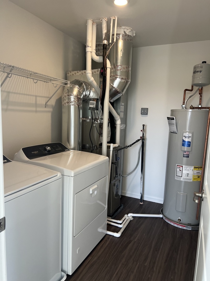 146 Henderson Street Oswego, IL 60543 - Photo 11 of 19 a utility room with dryer and washer