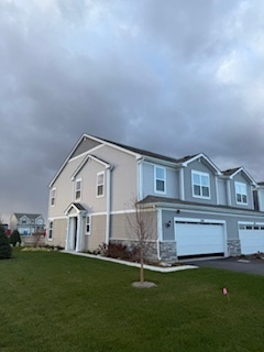 146 Henderson Street Oswego, IL 60543 - Photo 2 of 19 a front view of a house with a garden