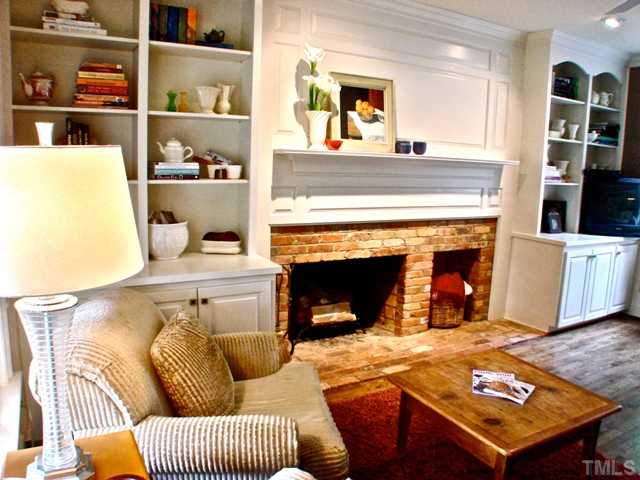 3316 Churchill Road Raleigh, NC 27607 - Photo 6 of 25 a living room with furniture and a fireplace