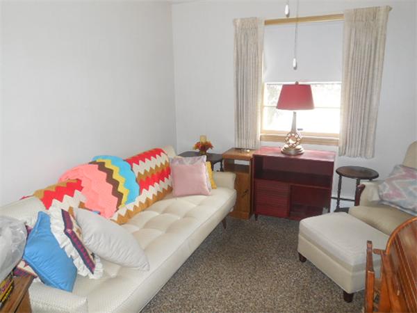 117 Dewitt Street Springfield, MA 01129 - Photo 8 of 14 a living room with furniture and a lamp