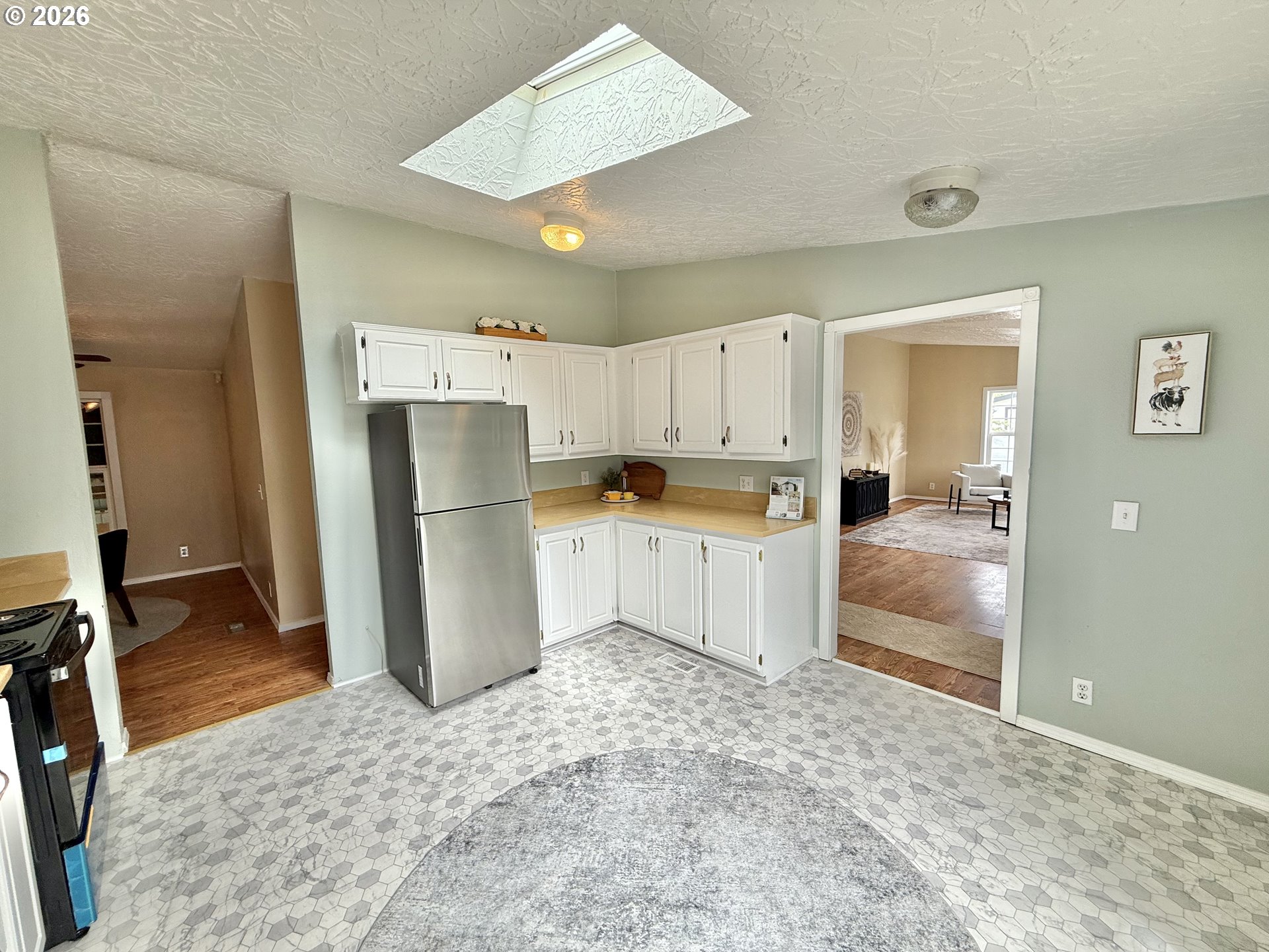 1282 3rd Street, Unit 37 Lafayette, OR 97127 - Photo 8 of 28 a kitchen with granite countertop a refrigerator and a sink