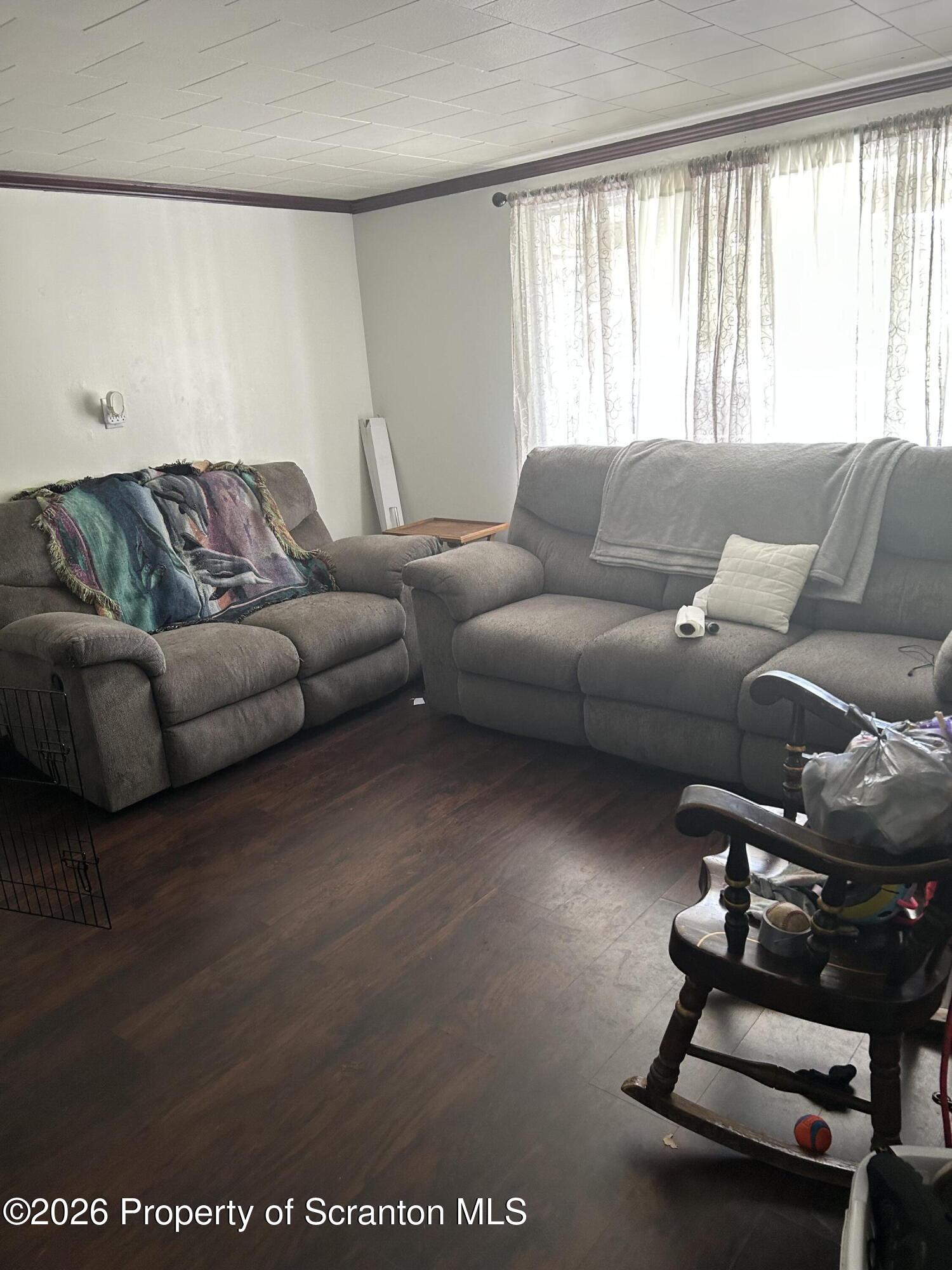 63 Shannon Street Simpson, PA 18407 - Photo 11 of 18 a living room with furniture and a window