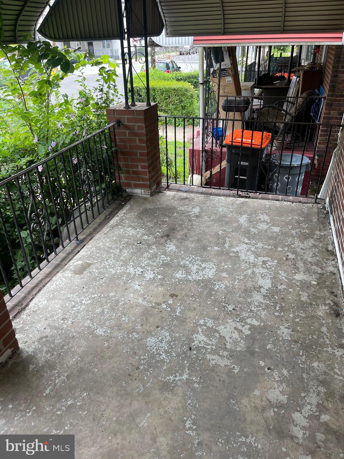 708 Jeffrey Street Chester, PA 19013 - Photo 3 of 13 a view of a patio with table and chairs under an umbrella